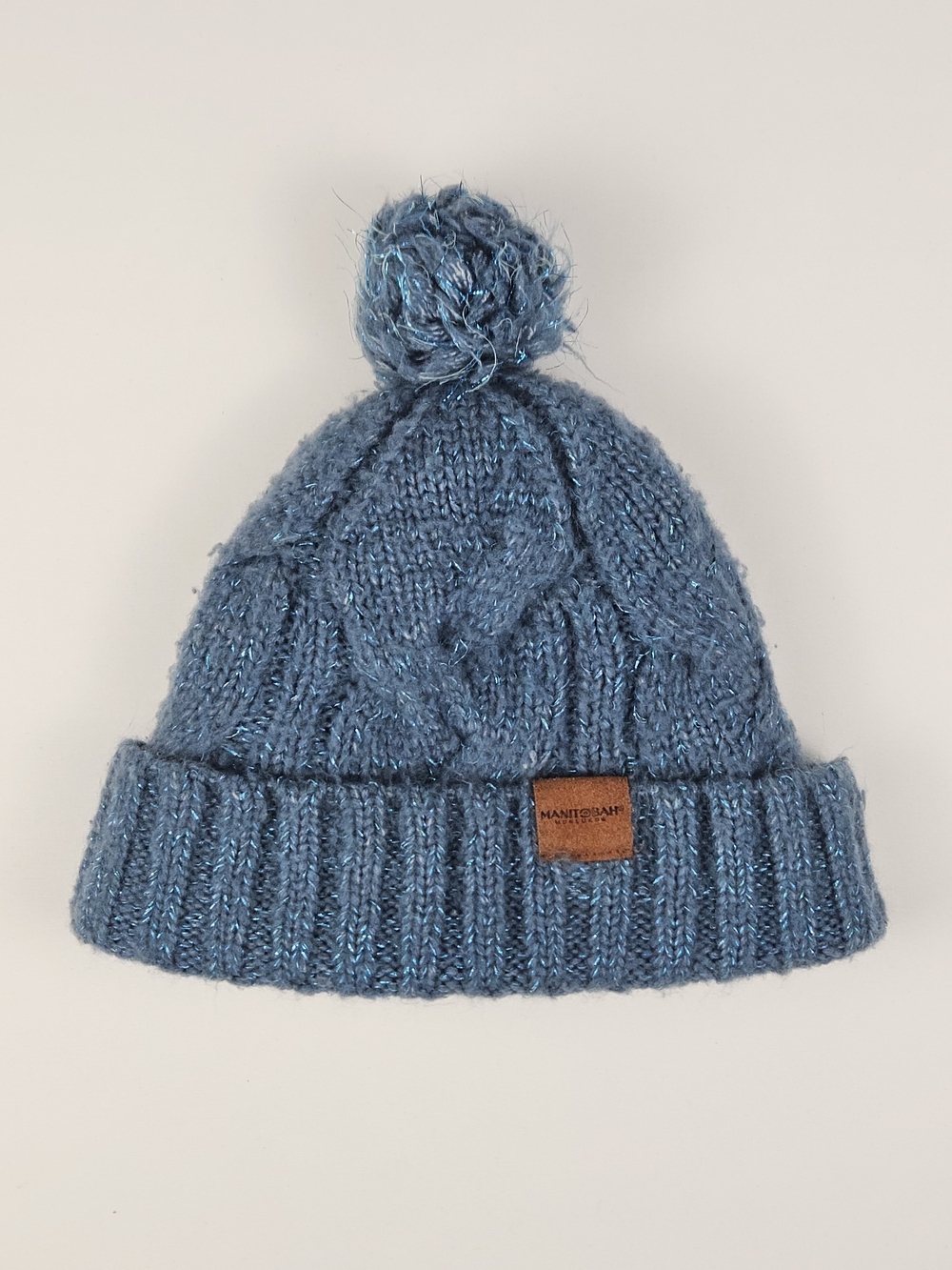Manitobah Mukluks⁠ Blue Cable Knit Pom Pom Beanie Sherpa